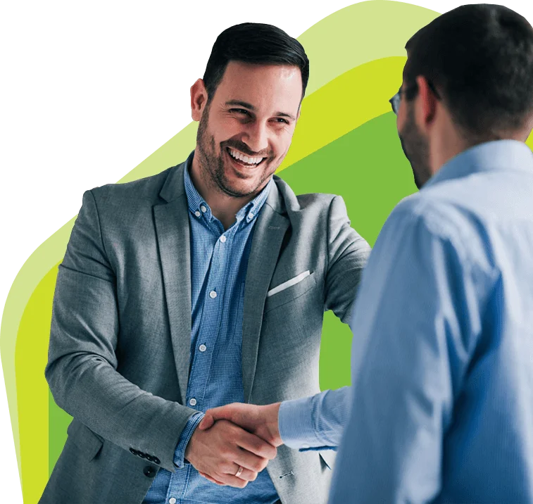 Two thirty-something men shaking hands.